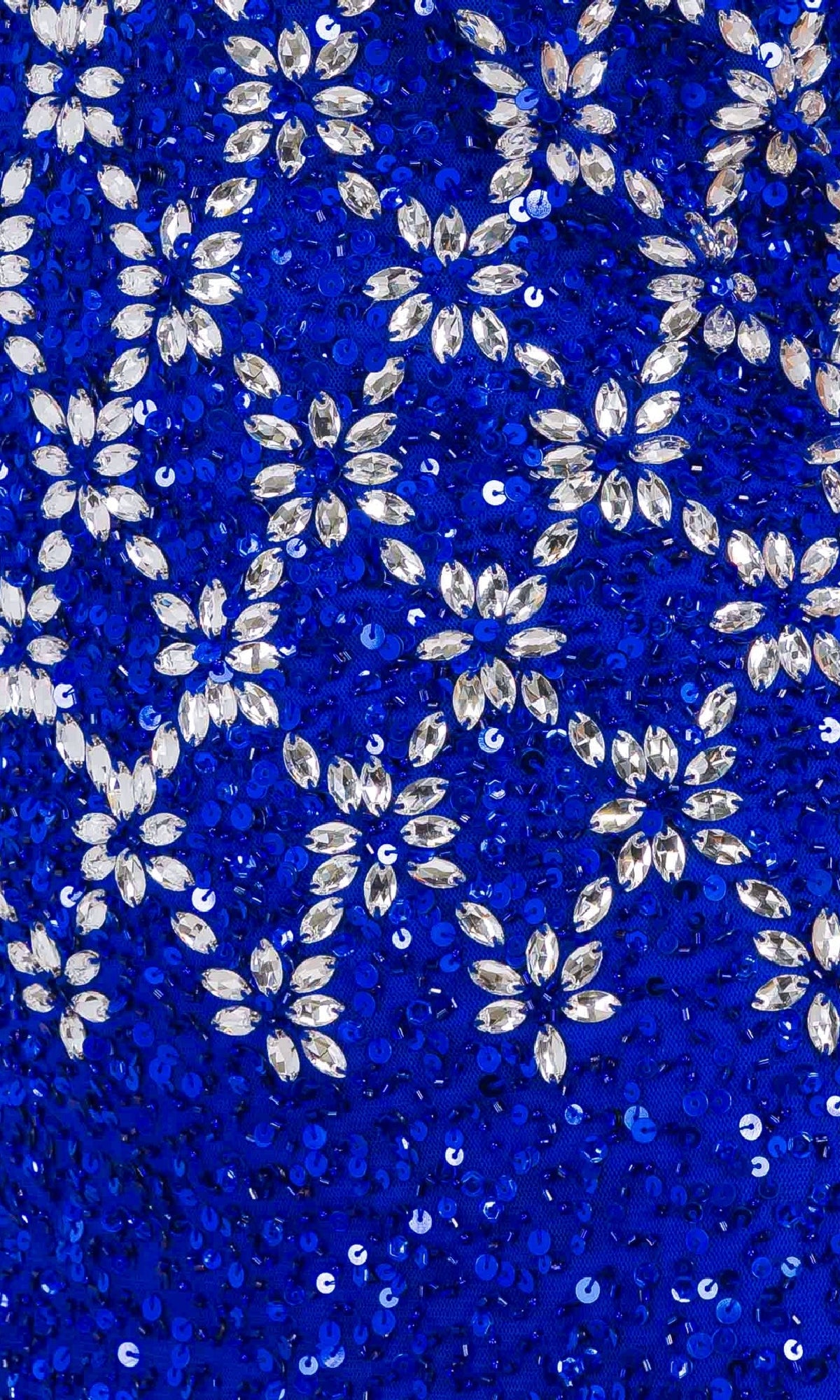 Close-up of the royal blue Strapless Beaded Prom Gown: Amelia Couture IN2001, featuring sequined and gem-like embellishments in floral and geometric patterns.